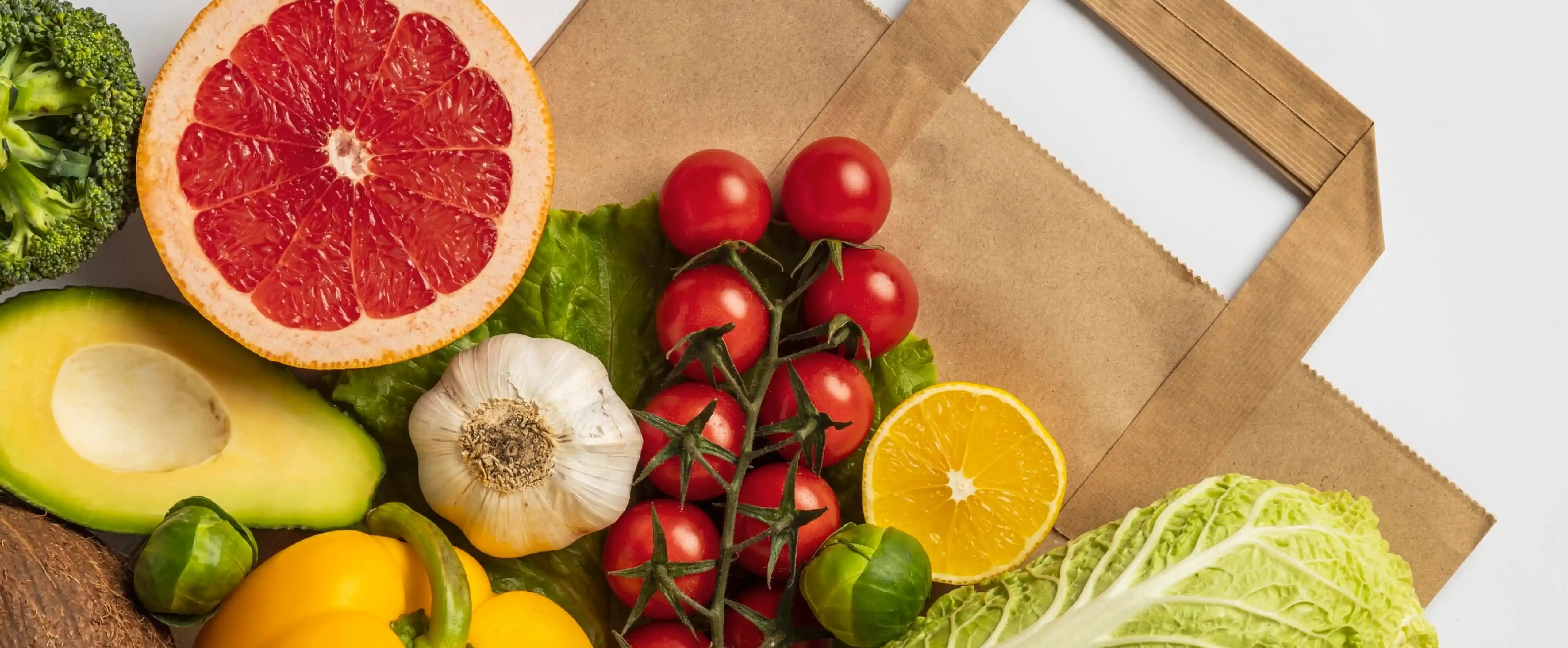 Fruits and vegetables lay on the bag